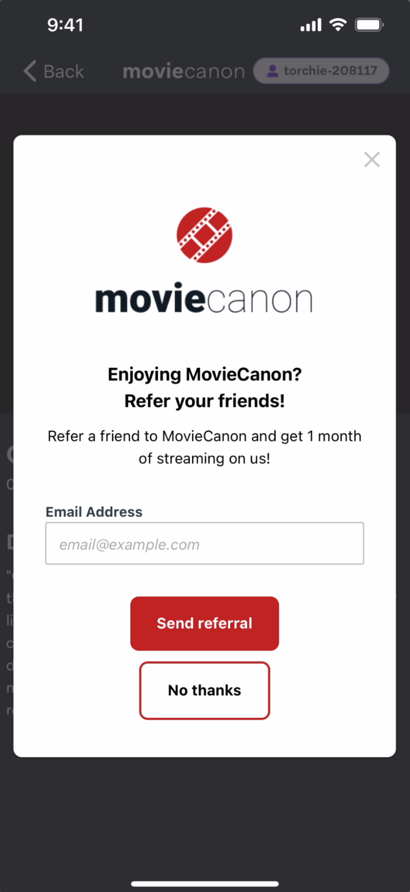 MovieCanonアプリ内メッセージ「MovieCanonを楽しんでいますか？お友達を紹介してください！」と表示され、メールアドレスを入力して紹介状を送ることができる。